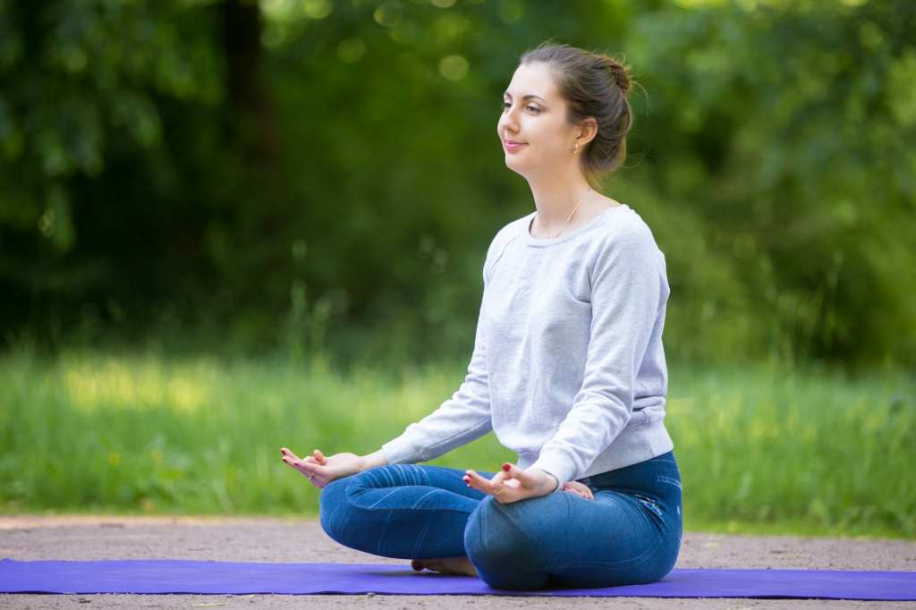 Woman practicing yoga for improving mental health