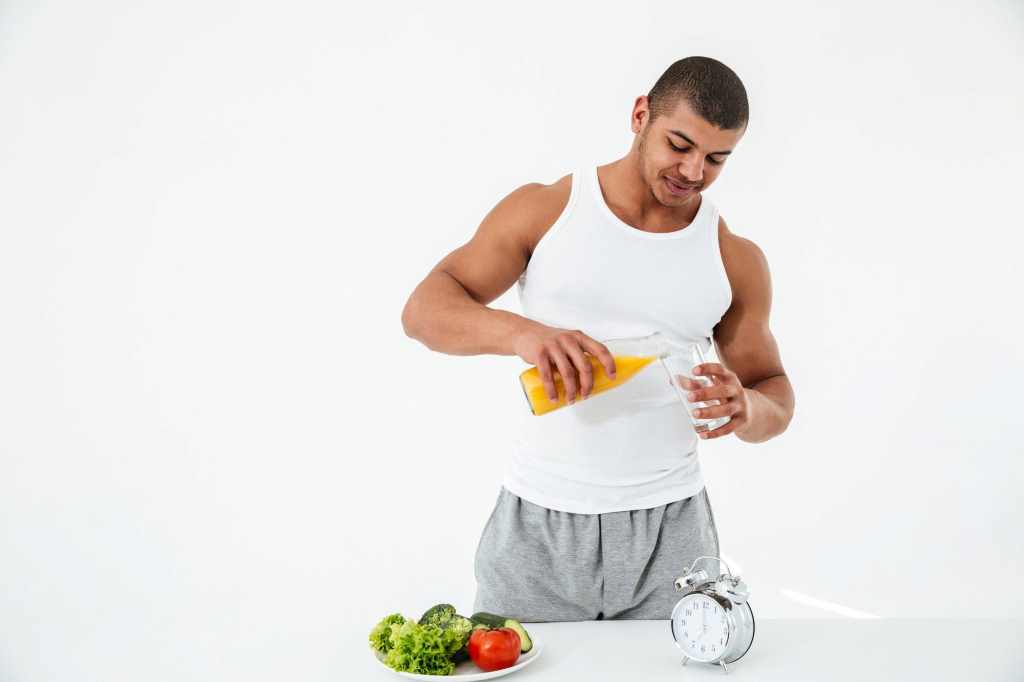 Male athlete taking nutritional supplements